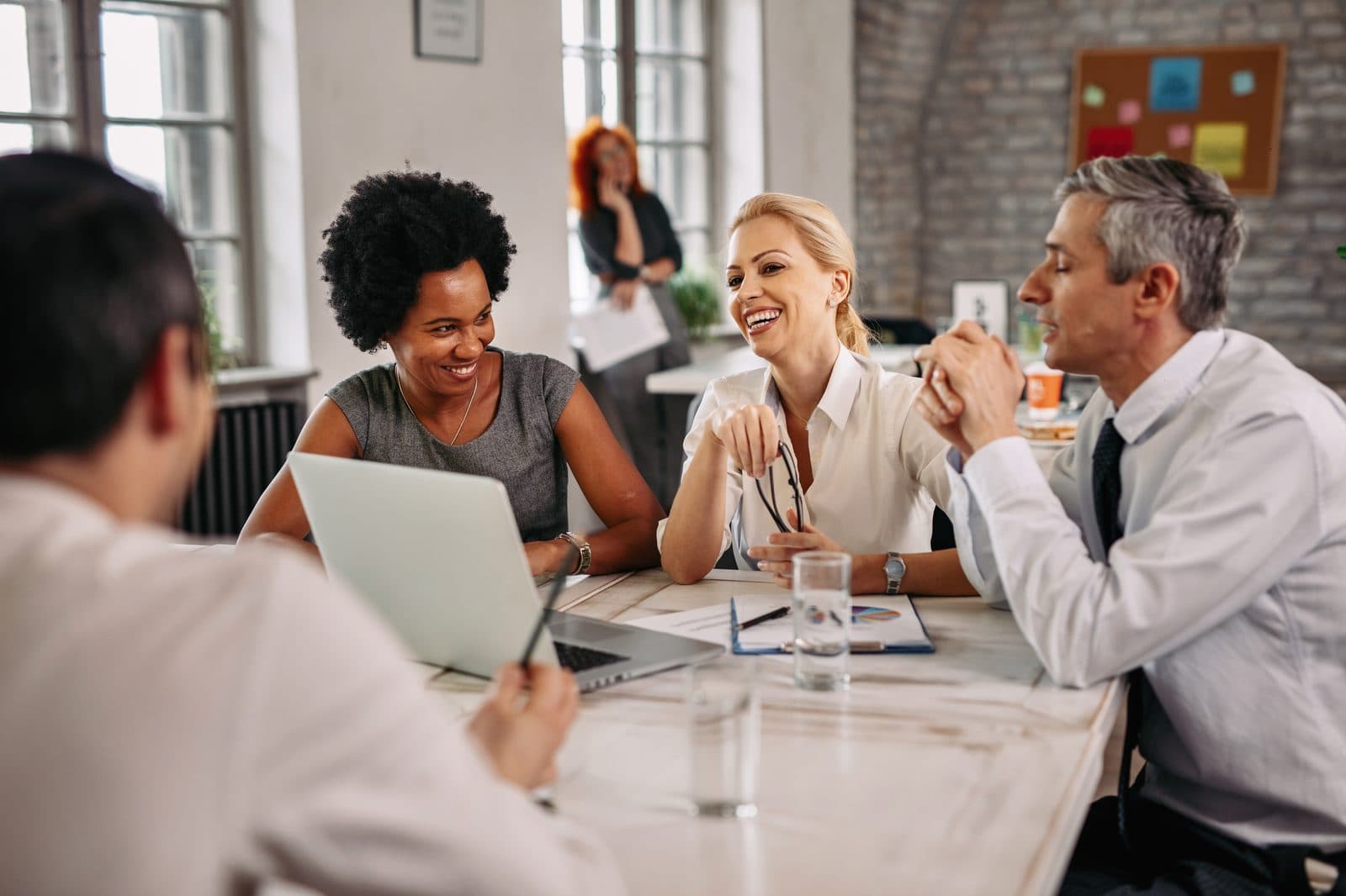A diverse hiring team collaborating in a bright modern office